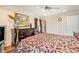 Comfortable bedroom with dresser, closet, ceiling fan and traditional design elements at 733 Huntington Se Pl, Marietta, GA 30067