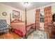 Cozy bedroom featuring a four-poster bed, hardwood floors, and traditional decor at 733 Huntington Se Pl, Marietta, GA 30067