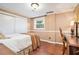 Bright bedroom featuring hard wood floors, closet, and window for natural light at 733 Huntington Se Pl, Marietta, GA 30067