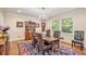 Formal dining room features beautiful hardwood floors, chandelier and crown molding at 733 Huntington Se Pl, Marietta, GA 30067
