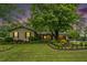 Charming single-Gathering home with lush landscaping, mature trees, and a well-manicured lawn at 733 Huntington Se Pl, Marietta, GA 30067