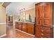 Basement kitchenette with wood cabinets, granite countertop, microwave and small sink at 733 Huntington Se Pl, Marietta, GA 30067