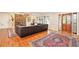 Spacious living room featuring hardwood floors, a cozy fireplace, and large windows for ample natural light at 733 Huntington Se Pl, Marietta, GA 30067
