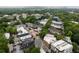 Aerial view of a cityscape featuring rooftops of homes, buildings, and lush trees at 1583 Braeburn Se Dr, Atlanta, GA 30316