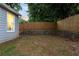 Grassy backyard with retaining wall, offering a peaceful and private outdoor space at 1583 Braeburn Se Dr, Atlanta, GA 30316