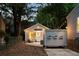 Exterior view of the house with a private backyard and charming, well-lit shed at 1583 Braeburn Se Dr, Atlanta, GA 30316