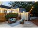 Backyard with patio furniture, a storage shed and string lights, perfect for relaxing at 1583 Braeburn Se Dr, Atlanta, GA 30316