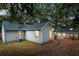 Landscaped backyard with mulched area, complemented by a charming swing for relaxation at 1583 Braeburn Se Dr, Atlanta, GA 30316