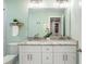 Charming bathroom vanity with granite top, double sinks, and decorative accents at 1583 Braeburn Se Dr, Atlanta, GA 30316