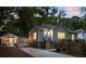 Charming home with a fenced yard, featuring a blue front door and tasteful landscaping at 1583 Braeburn Se Dr, Atlanta, GA 30316