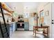 Bright kitchen featuring blue cabinets and modern appliances at 1583 Braeburn Se Dr, Atlanta, GA 30316