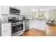 Stylish kitchen with stainless steel appliances, granite counters, and hardwood floors at 1583 Braeburn Se Dr, Atlanta, GA 30316