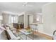 Bright living room with hardwood floors, a ceiling fan, and a breakfast bar area at 1583 Braeburn Se Dr, Atlanta, GA 30316