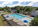Community pool with ample seating and lounge chairs on a sunny day at 211 Augusta Woods Dr, Villa Rica, GA 30180