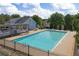 Community pool and sundeck features lounge chairs for relaxing by the water at 211 Augusta Woods Dr, Villa Rica, GA 30180
