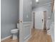 Entryway with wainscoting detail and a half bath at 211 Augusta Woods Dr, Villa Rica, GA 30180