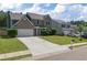 Charming two-story home with brick accents, a well-manicured lawn, and a spacious driveway at 211 Augusta Woods Dr, Villa Rica, GA 30180