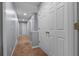 Upstairs hallway with neutral walls and carpet, with white doors and trim at 211 Augusta Woods Dr, Villa Rica, GA 30180