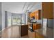 Well-lit kitchen with a center island, stainless steel appliances, and hardwood floors, offering modern convenience at 211 Augusta Woods Dr, Villa Rica, GA 30180