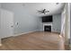 Bright living room with a fireplace, ceiling fan and light wood floors at 211 Augusta Woods Dr, Villa Rica, GA 30180