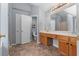 Main bathroom with double vanity, neutral flooring, and separate toilet area at 211 Augusta Woods Dr, Villa Rica, GA 30180