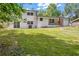 Expansive backyard with lush green grass, offering plenty of space for outdoor activities at 2678 Rainbow Forest Dr, Decatur, GA 30034
