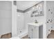 Updated bathroom with new fixtures, shower, sink, and mirror, and stylish vanity at 2678 Rainbow Forest Dr, Decatur, GA 30034