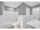 Bathroom with tub-shower combo, toilet, new vanity, neutral paint, and updated fixtures at 2678 Rainbow Forest Dr, Decatur, GA 30034