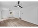Bright and airy bedroom featuring hardwood floors, two ceiling fans, and access to the outdoors at 2678 Rainbow Forest Dr, Decatur, GA 30034