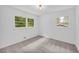 A bright bedroom featuring two windows with views of the exterior at 2678 Rainbow Forest Dr, Decatur, GA 30034