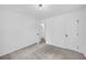 A cozy bedroom featuring neutral walls, carpet, and a modern light fixture at 2678 Rainbow Forest Dr, Decatur, GA 30034