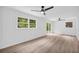 Spacious bedroom featuring hardwood floors, two ceiling fans, and large windows offering natural light at 2678 Rainbow Forest Dr, Decatur, GA 30034