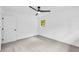 An empty bedroom featuring neutral carpet, white walls and ceiling fan at 2678 Rainbow Forest Dr, Decatur, GA 30034