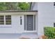 Stylish front entrance with a modern door, contrasting black hardware, and visible house numbers at 2678 Rainbow Forest Dr, Decatur, GA 30034
