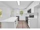 Modern kitchen with white cabinets, stainless steel appliances, and stylish countertop island with gold hardware at 2678 Rainbow Forest Dr, Decatur, GA 30034