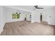Spacious living room featuring sleek light wood floors, recessed lights, and an open layout at 2678 Rainbow Forest Dr, Decatur, GA 30034