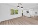 Bright living room boasts hardwood floors, a large window, and access to the kitchen at 2678 Rainbow Forest Dr, Decatur, GA 30034