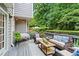 Spacious back deck with comfortable seating, an outdoor rug, and a serene view of the backyard at 4792 Fairville Ct, Marietta, GA 30062
