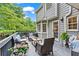 Relaxing deck area with comfortable seating, plants, and charming outdoor decor at 4792 Fairville Ct, Marietta, GA 30062