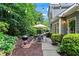 Charming backyard with string lights, patio seating, a grill, and lush landscaping at 4792 Fairville Ct, Marietta, GA 30062