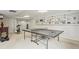 Basement featuring a ping pong table, workout equipment, and built-in shelving at 4792 Fairville Ct, Marietta, GA 30062