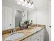 Bathroom features double sinks with granite countertops and a large vanity mirror at 4792 Fairville Ct, Marietta, GA 30062