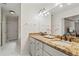 Bathroom with granite counters, double sink vanity and view to bedroom at 4792 Fairville Ct, Marietta, GA 30062