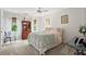 Cozy bedroom with neutral colors, light carpet and natural light from two windows at 4792 Fairville Ct, Marietta, GA 30062