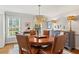 Charming dining room featuring a round table, leather chairs, decorative lamps, and a view to the outside at 4792 Fairville Ct, Marietta, GA 30062