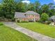 Traditional brick home with a manicured lawn and long drive, offering classic curb appeal at 4792 Fairville Ct, Marietta, GA 30062