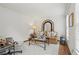Cozy living room with neutral tones, decorative mirror, and elegant furnishings at 4792 Fairville Ct, Marietta, GA 30062