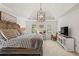 Comfortable main bedroom featuring a king-size bed, soft carpet and a decorative ceiling fan at 4792 Fairville Ct, Marietta, GA 30062