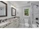 Spacious bathroom with a double vanity, granite countertops, and a walk-in shower at 5301 Regency Lake Ct, Sugar Hill, GA 30518