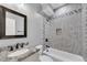 Elegant bathroom with marble countertops, modern fixtures, and a stylish tile design at 5301 Regency Lake Ct, Sugar Hill, GA 30518